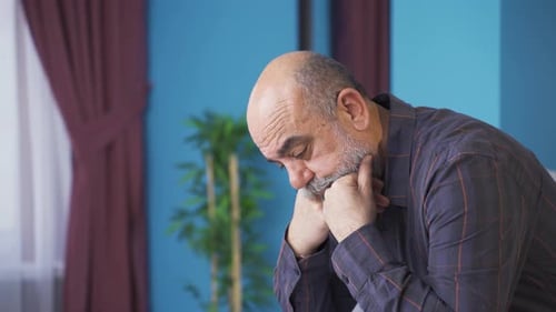 Depressed old man thoughtful.