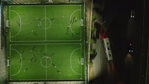 Aerial View of a Mini Football Match Soccer MiniFootball Field and Footballers From Drone