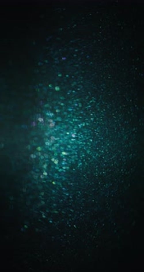 Abstract Teal Blue Shimmering Bokeh Lights Background