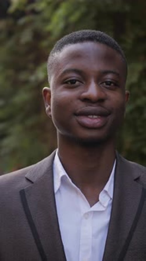Close Up Portrait of Confident Businessman in Stylish Suit Standing on Street