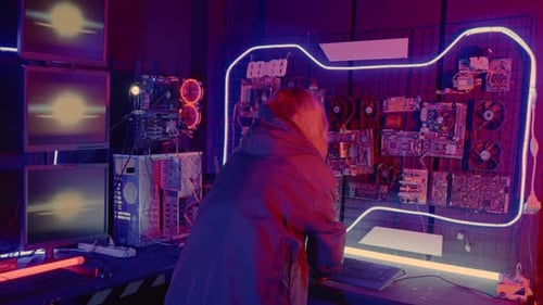 Asian Woman Wearing a Black Jacket Hacking Programming System Check Hacking Hardware Circuit in Dark