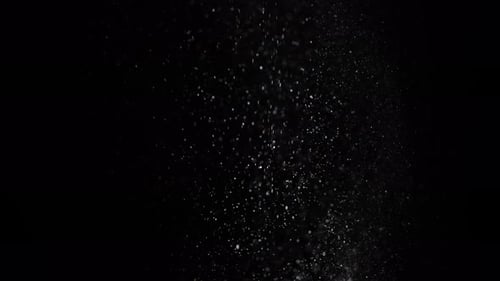 Abstract Glittering Particles on Black Background