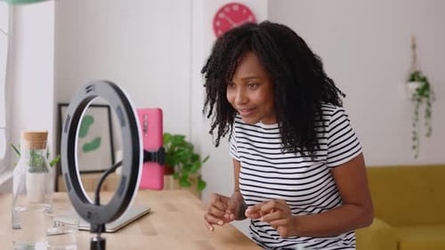 Woman Records Vlog with Ring Light at Home