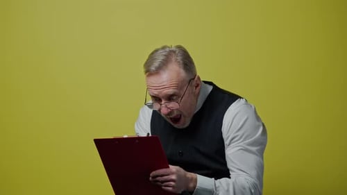 Excited Man Reading Documents on Clipboard