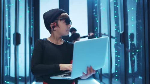 Children Work on Laptop in Data Center