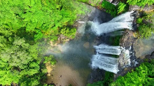 Stunning waterfall in a tropical forest from a bird's eye view.