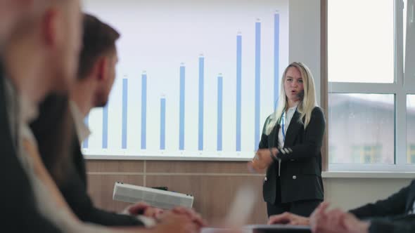 Professional Woman Presents Business Charts to Colleagues, Business ...