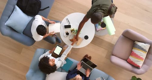 Diverse Team Collaborating in Modern Office from Above