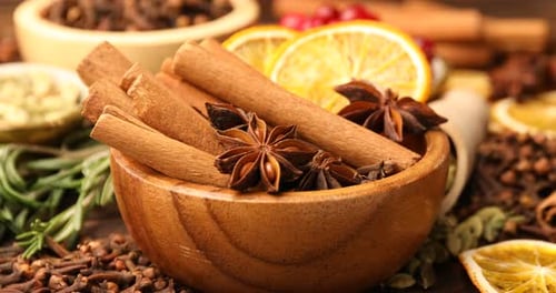 Close-up of Cinnamon Sticks with Spices and Orange