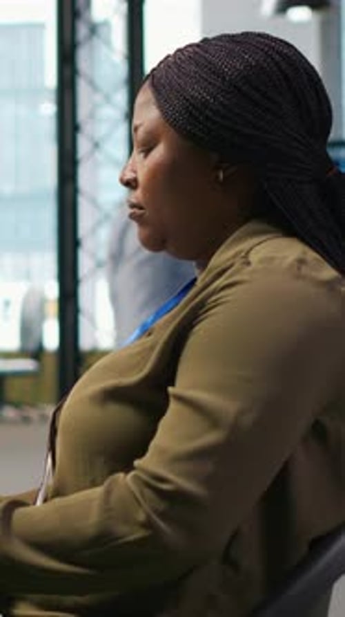 Vertical Video Computer Scientist in Startup Office Reviewing AI System Metrics