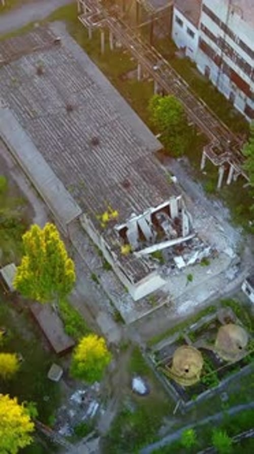 Abandoned Warehouses And Factories. Top view of the abandoned factory with broken windows