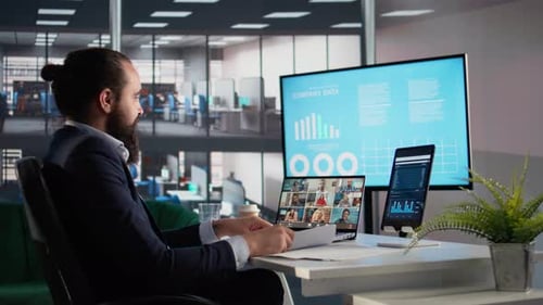 Man Attending Online Meeting in Modern Office