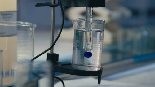 Close Up Measuring Clear Liquid in Graduated Cylinder