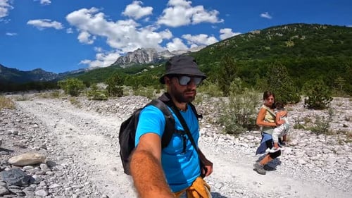 A couple walking on the trail on the Valbona Valley trekking to Theth, Theth National Park, Albanian