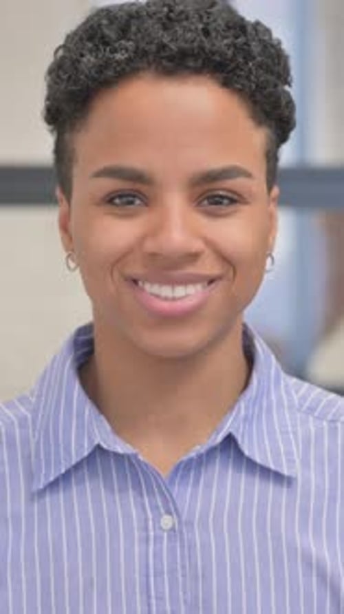 Portrait of Smiling African Woman in Office, vertical video
