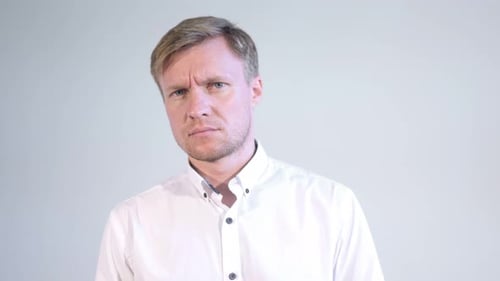 Stern Man Looking Intently at the Camera