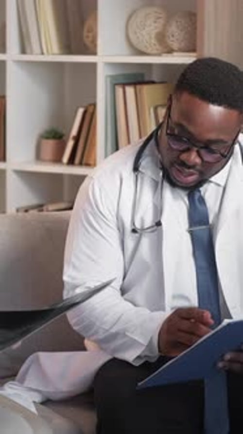 Healthcare Workers Reviewing X-ray Results in Office