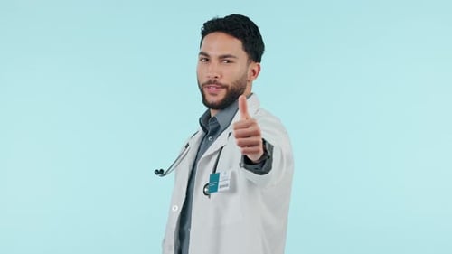 Man, doctor and thumbs up, healthcare support or success, thank you and like emoji on a blue
