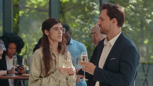 Adults Celebrating and Drinking Champagne at Gathering