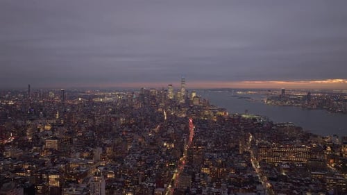 Aerial View of Purple Twilight Enveloping Manhattan in New York City Street Lights Glowing Amid