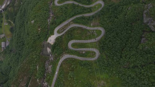 Drone View of Cars Driving on Serpentine Mountain Road in Norway