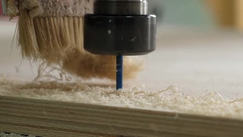 Closeup of a Powerful Wood Cutter Working with Plywood in a Carpentry Workshop
