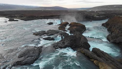 Aerial footage over the powerful waterfall Godafoss in Iceland, Showing its full potential and beaut