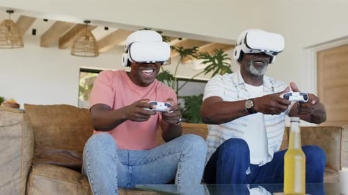 Two Men Play Video Games With VR Headsets