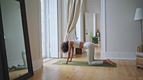 Woman Doing Yoga Stretching in Home Interior