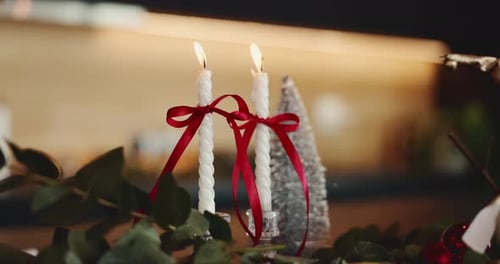 Festive Holiday Candles with Decorations Close Up