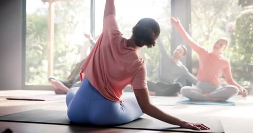 Yoga, trainer and class with stretching in studio for flexibility, holistic wellness