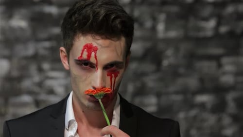 Man with Halloween Makeup and Orange Flower