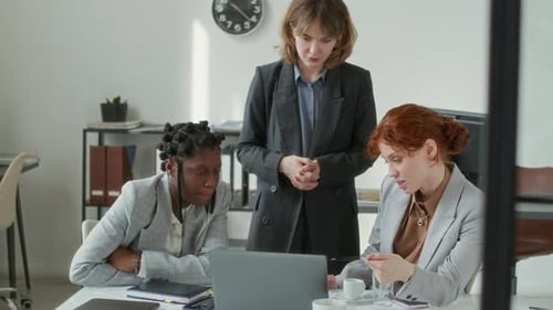 Team Working Together at Modern Office Desk