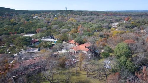 A wedding venue in the Texas Hill Country sits on a creek laced with cypress trees and cedar blanket