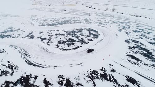 Cars Drifting on Snowy Ice Track in Winter Aerial Drone View