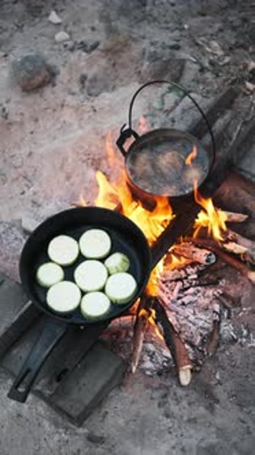 Cooking Over Campfire on Beach