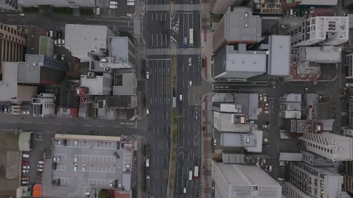 Top Down Panning Footage of Wide Multilane Road Surrounded with Multistorey Buildings in Urban