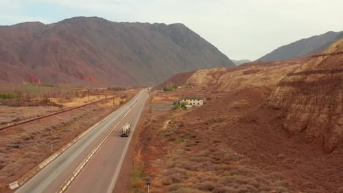 Highway through mountains rock orange sandstone, aerial view, panorama scenic nature
