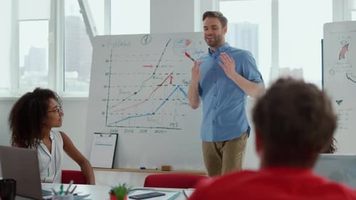 Team Discussing Data at Whiteboard in Modern Office