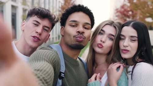 Diverse Students Taking Selfie on Campus Smiling