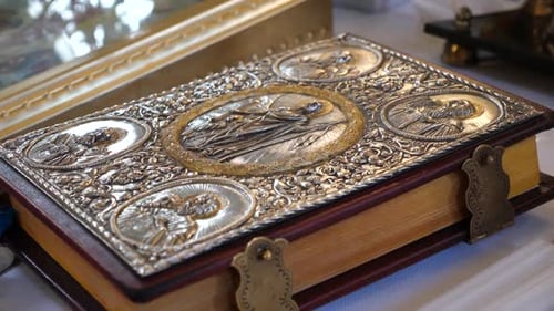 46 1A large Gospel with a metal cover and clasps on the altar in the church.