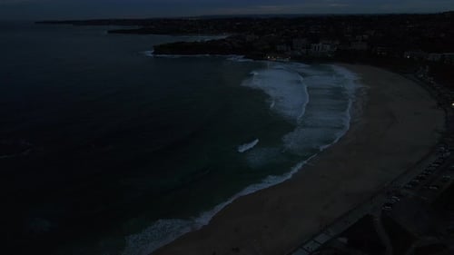 Drone shot of Bondi beach at night. Ocean and sea stock videos.