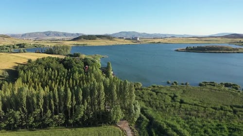 Aerial View Of Forest, Lake And Hills