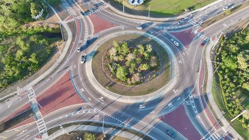 Top View of City Street Traffic on Roundabout Intersection with Moving Cars Viev From Above of Urban