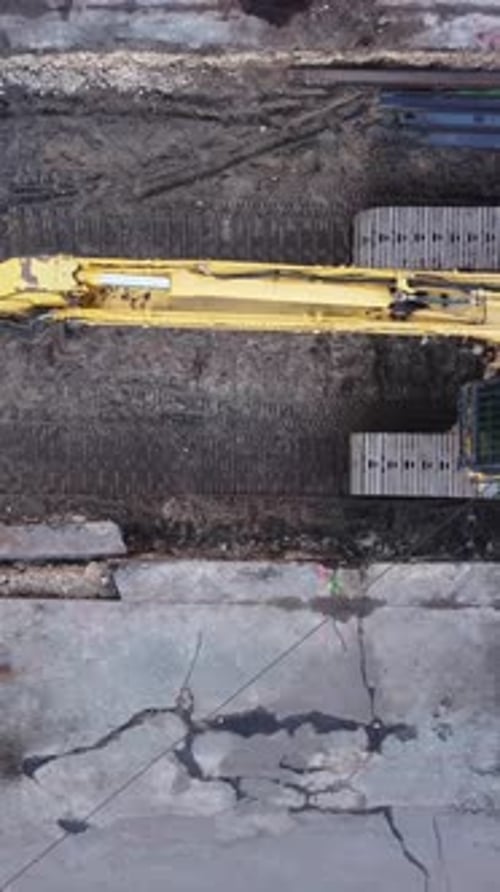 Aerial View of Yellow Excavator on Construction Site