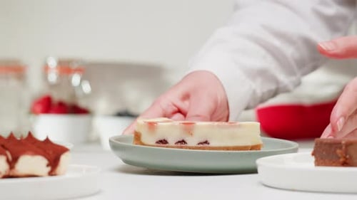 Woman Presents Strawberry Cheesecake Slice