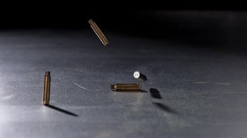 Empty Bullet Casings Falling in Slow Motion
