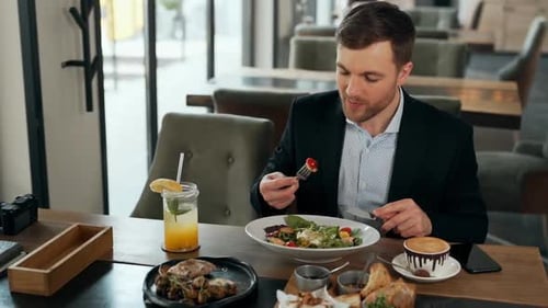 Man Enjoys Healthy Lunch at Restaurant