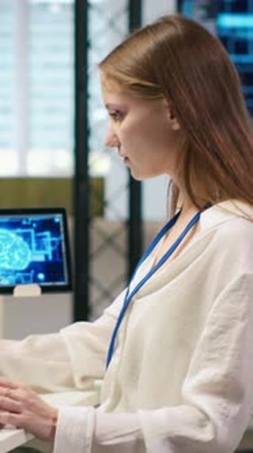 Vertical Video Junior Dev in Office Relies on AI Tech to Run Tasks Across Multiple Devices