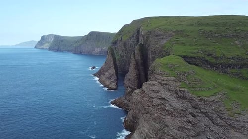 Captivating beauty of majestic cliffs alongside the tranquil sea, featuring unique rock structures.